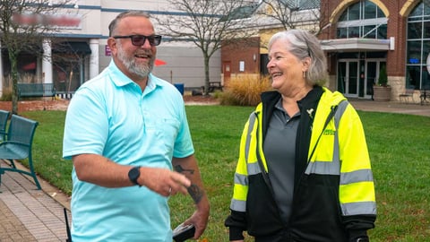 level green team member meets with property manager