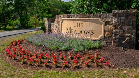 The Meadows entrance sign with plantings